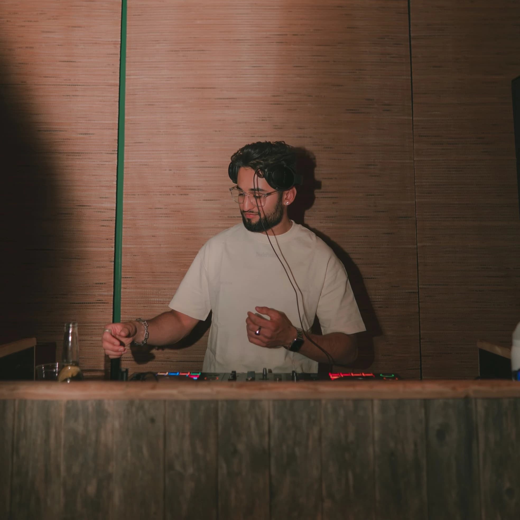 Chirag Chadha behind the decks DJing